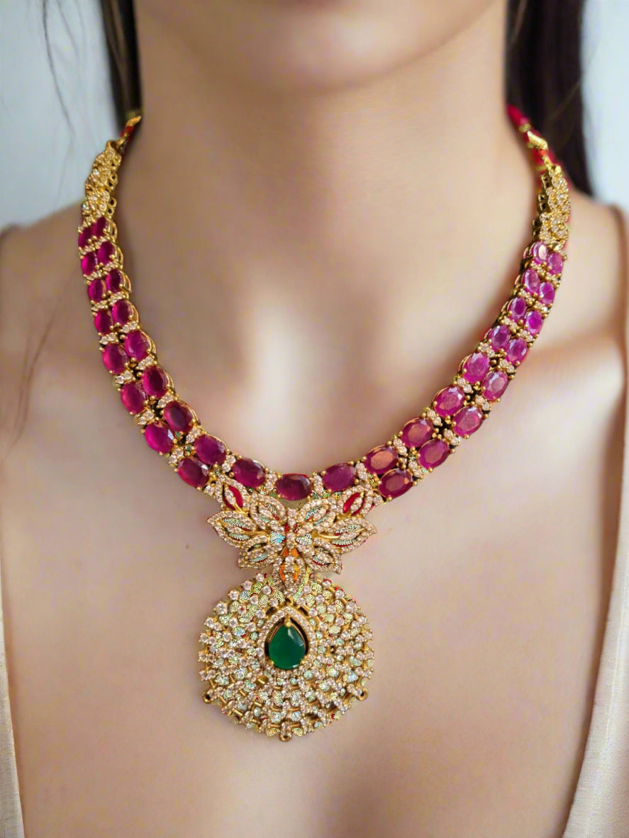 Gold necklace with red beads
