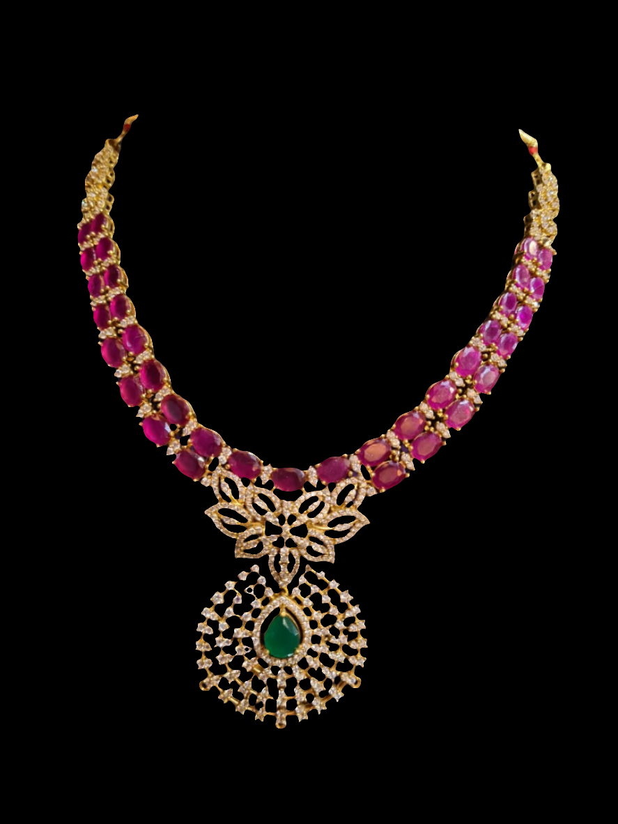 Gold necklace with red beads